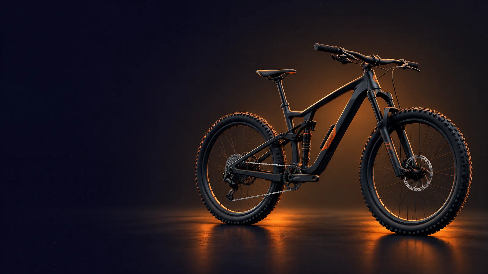 A dark mountain bike lit by an orange rim light on a reflective studio floor
